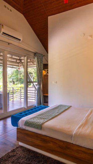 Nysa-Estate-5-bhk-luxury-villa-in-coorg-with-private-pool-and-spacious-rooms-bedroom-balcony-view