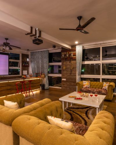 Nysa-Estate-5-bhk-luxury-villa-in-coorg-with-private-pool-and-spacious-rooms-livingroom-projector-view